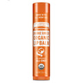 Dr. Bronners Orange Ginger Organic Lip Balm, with U.S. hemp oil, stands upright against a white background. Text includes Family Soapmakers Since 1858, All One, USDA Organic, Net Wt 0.15oz4g [.15 oz]
