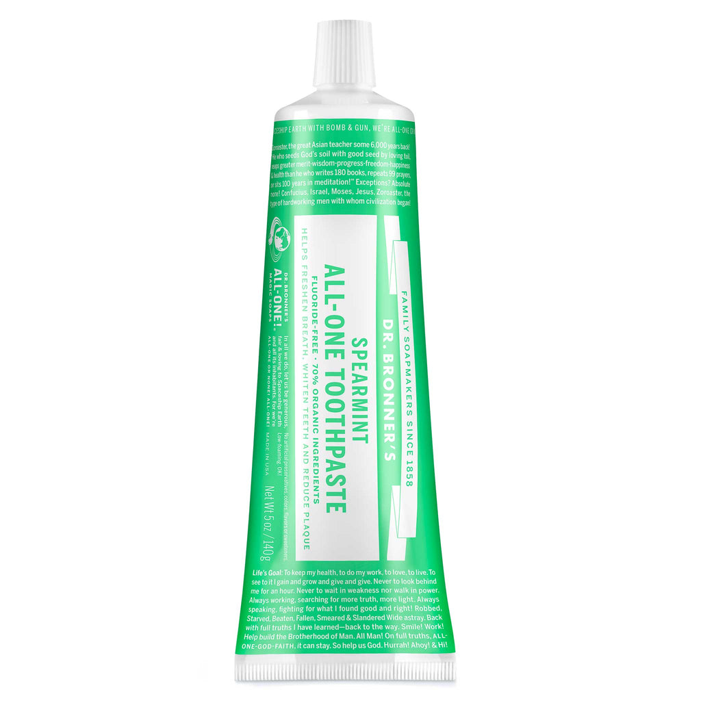 A green and white tube labeled Dr. Bronners All One Toothpaste Spearmint contains organic ingredients for dental care. It stands upright, featuring detailed usage instructions and branding text, emphasizing eco friendly virtues [5 oz]