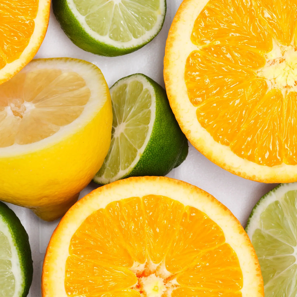 Slices of vibrant oranges, lemons, and limes are arranged together, showcasing their bright, fresh colors. This citrus medley evokes thoughts of natural, organic ingredients, ideal for sustainable products [5 oz]