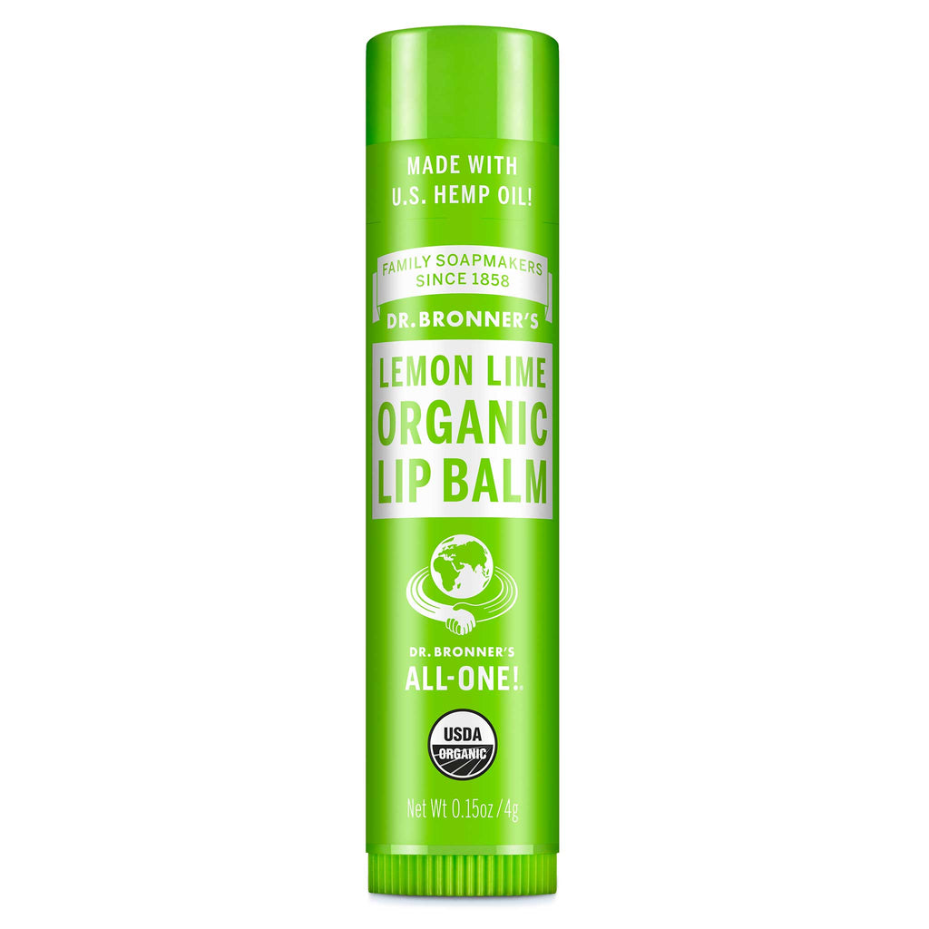 A green tube labeled Dr. Bronners Organic Lip Balm Peppermint stands upright, featuring certifications and text about organic and fair trade ingredients, set against a plain white background [.15 oz]
